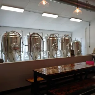 a row of stainless steel tanks