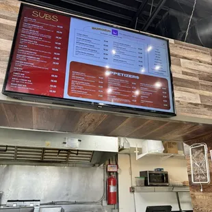 Menu is high above and there isn't much room to view it. Make sure you grab a paper menu to look at.