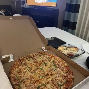 XXL cheese pizza with green pepper, onion, and pineapple. Garlic Cheese Bread (8 pcs)