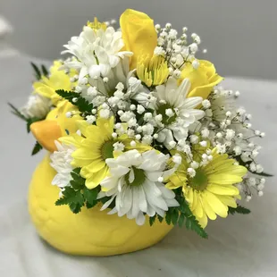 Baby bouquet in a yellow ducky ceramic