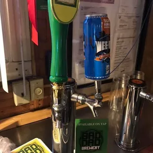 a beer tap and a beer can
