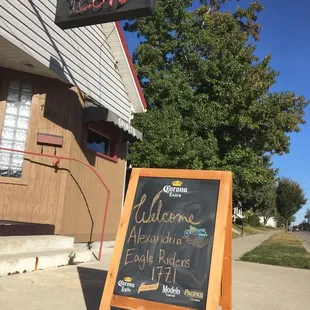 a welcome sign outside a restaurant