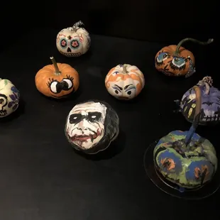 a variety of painted pumpkins