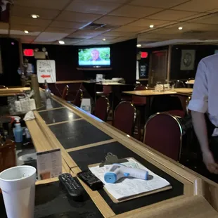 a man standing at the bar