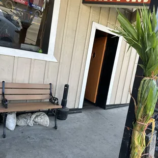 a bench outside of a restaurant