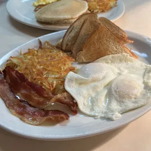 Bacon, eggs, hash browns and toast.