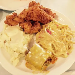 First plate from the buffet. Chicken tenders, chicken spaghetti, mashed potatoes with cream gravy, and a chimichanga bite.