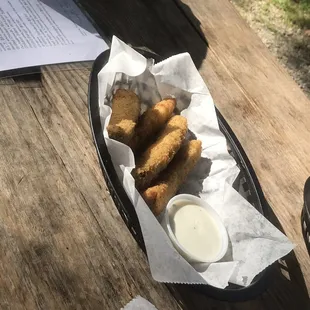 a basket of fried food on a picnic table