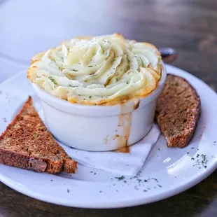 a bowl of soup and bread