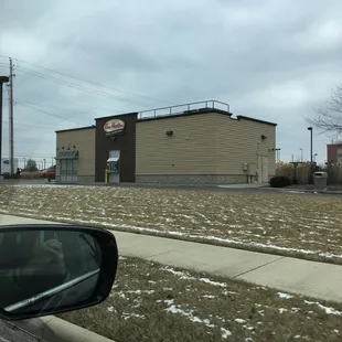 a view of a building from a car window