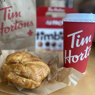 Sausage croissant with a large mocha coffee and Timbits Pack on the side