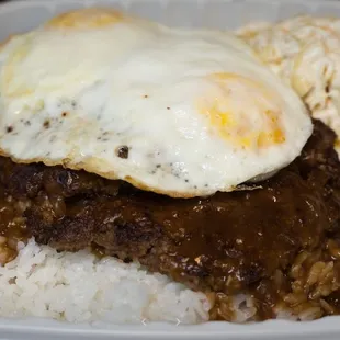 a fried egg over rice