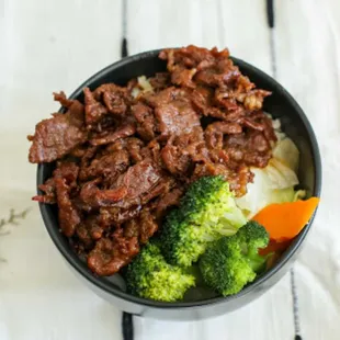 a bowl of beef and broccoli