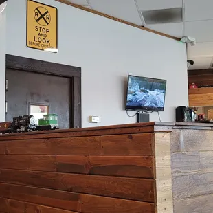 a wooden counter with a tv on it