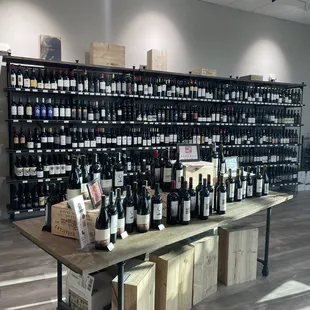 a large display of wine bottles