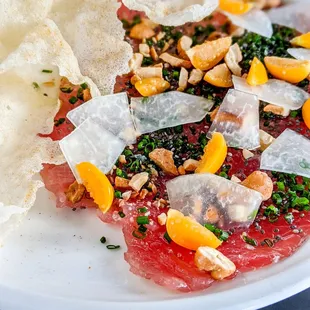 Ahi Tuna Carpaccio with gooseberry, cashews, pickled green papaya and Galangal vinaigrette  |  Instagram @tabletopviews