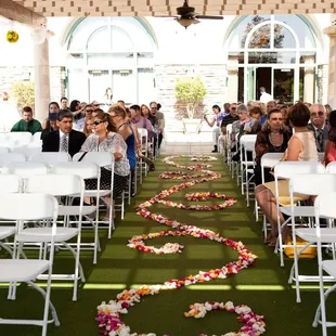 Outdoor ceremonies in our beautiful Rose Garden.  Guests are shaded and cooled by our beautiful fans