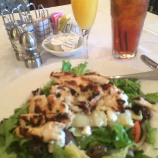 Greek salad iced tea and complementary orange juice