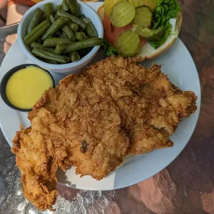 a plate of fried chicken and green beans