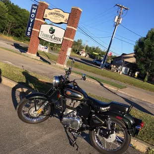 a motorcycle parked in front of a restaurant