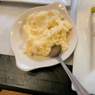 The mashed potatoes are old-school, rich and delicious with blended Asiago cheese!