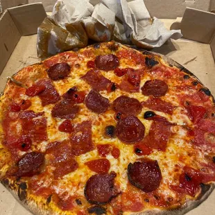 It is true, this pizza is greasy as you can see with the greased up napkins