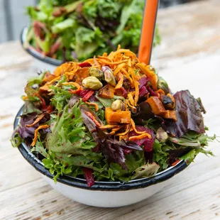 a salad with carrots and lettuce