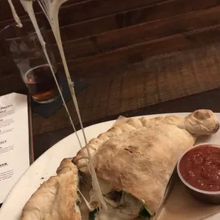 I got it mit hot sausage and spinach.  Room for three or four stuffings in there if you really want, but two left a pleasant pillow.