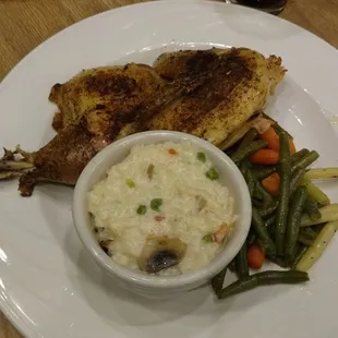 The roasted half chicken with veggies and mushroom risotto. It also comes with a side salad.