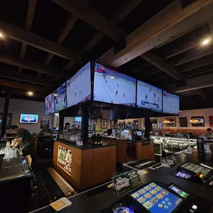 a bar with multiple screens