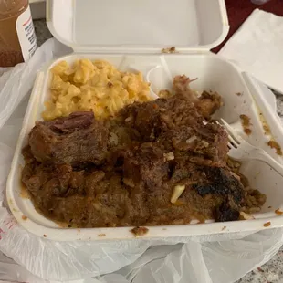 A plate full of oxtails that has to thrown in the trash because they are so salty.