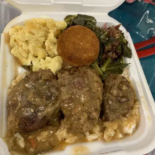Oxtails Over Rice with Drink with side of greens &amp; Mac n cheese