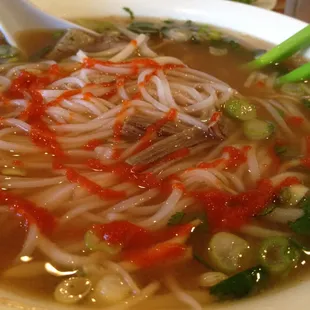 Rare beef and brisket pho with bean sprouts, lime, sriracha sauce and hoisin.