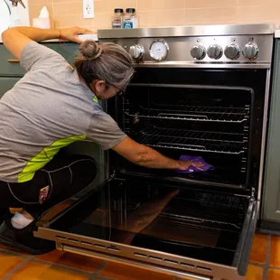 Inside stove cleaning service.