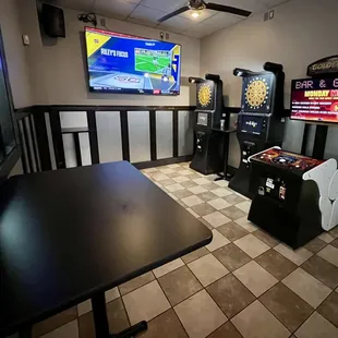Game Room featuring Golden Tee and two Dart Machines