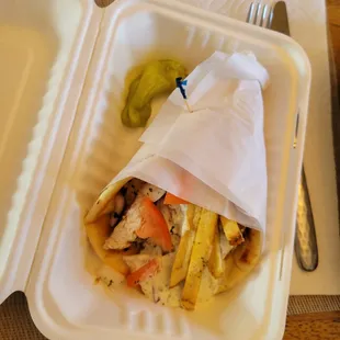 a sandwich in a styrofoam container