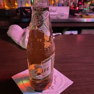 a bottle of beer on a table