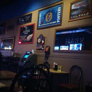 tables and chairs in a dimly lit restaurant
