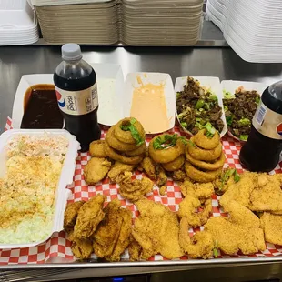 a tray of fried food and drinks