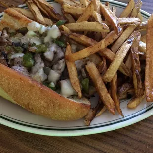 The Philly Cheese Steak with a side of fries.