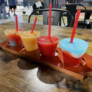 three drinks on a wooden tray