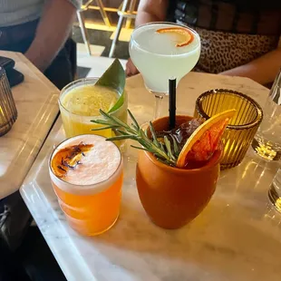 a variety of cocktails on a table
