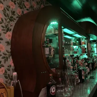 a bar with a large mirror