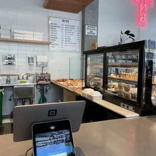 a laptop on a counter in a coffee shop