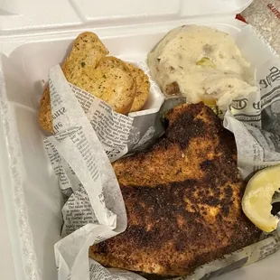 Blackened redfish with garlic mash potatoes (caesar salad not pictured)