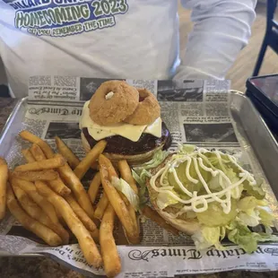 This is the Gold burger, top with melted pepper, jack cheese, Hickory, barbecue sauce, and two of their time grill onion rings