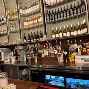 a bar with many bottles of wine