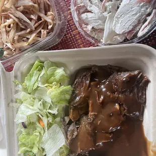 a variety of food items in a styrofoam container