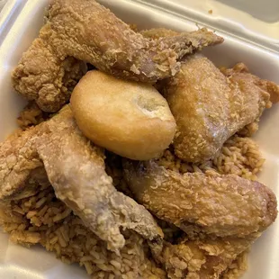 fried chicken and rice in a styrofoam container