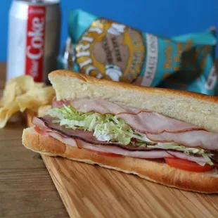 a ham and lettuce sandwich with chips